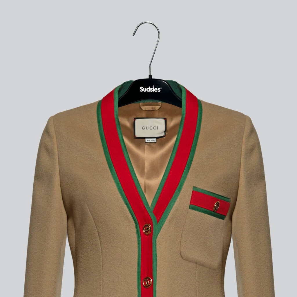 Gucci jacket with red and green trim on a Sudsies hanger.